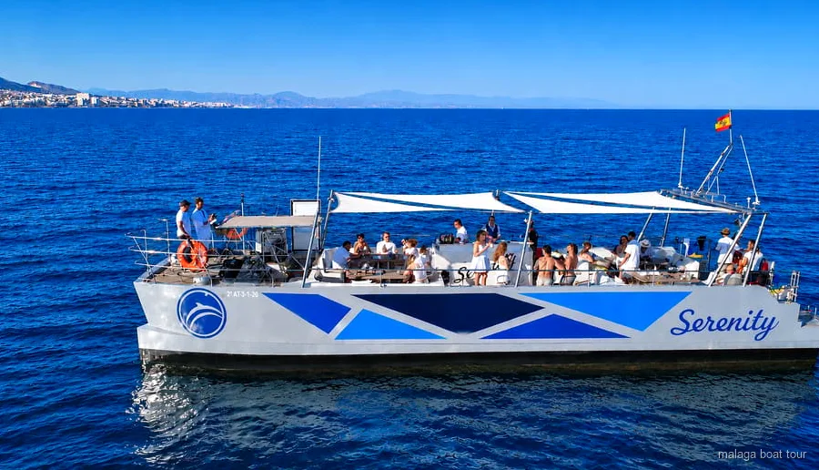 Catamaran searching for dolphins during the Malaga dolphin watching catamaran cruise